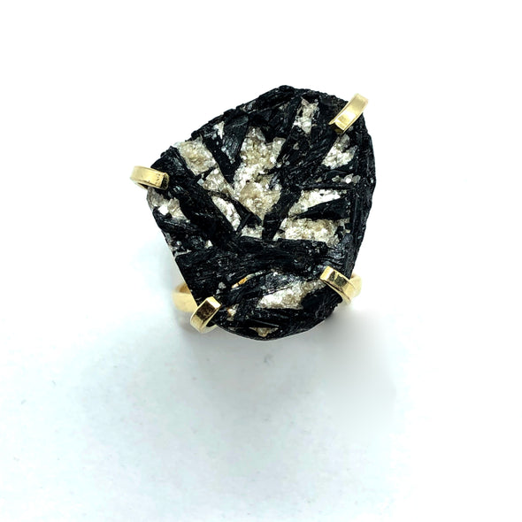 Black tourmaline ring. Black Tourmaline is a protective stone which repels and blocks negative energies and psychic attack. Black Tourmaline also aids in the removal of negative energies within a person or a space. Black Tourmaline will cleanse, purify, and transform dense energy into a lighter vibration.