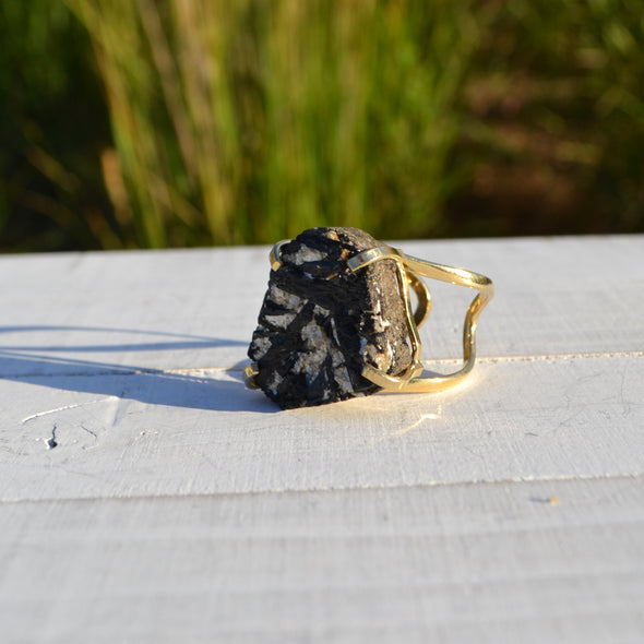 Black tourmaline ring. Black Tourmaline is a protective stone which repels and blocks negative energies and psychic attack. Black Tourmaline also aids in the removal of negative energies within a person or a space. Black Tourmaline will cleanse, purify, and transform dense energy into a lighter vibration.