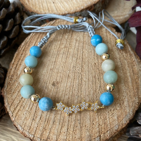 This beautiful bracelet for women was braided with a macramé technique and with an exclusive design. It is made with a wonderful semi-precious stone the Amazonite, and gold laminated 18K beads with a gorgeous stars charm in the middle.