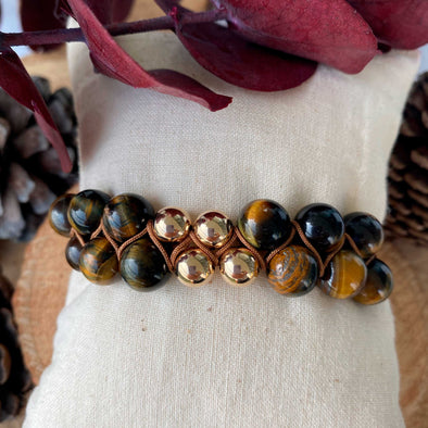 Gorgeous Tiger Eye bracelet, made with 10 mm tiger eye beads delicately wrapped with a light brown waxed string accompanied by four 8mm gold laminated 18K.