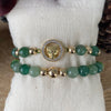 Precious Jade bracelet, made with 8 mm beads each and delicately braided with a green waxed string, accompanied by four 6 and 8mm gold laminated 18K beads.