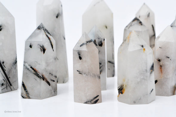 Black and white tourmaline towers. white towers with a black stripes.