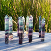 Beutiful rainbow fluorite towers 9x1 cms . purple and teal colours with stripes